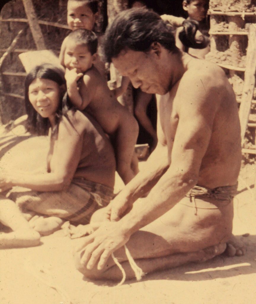 Ayore Men spin garabatá fibers on their thighs to make rope