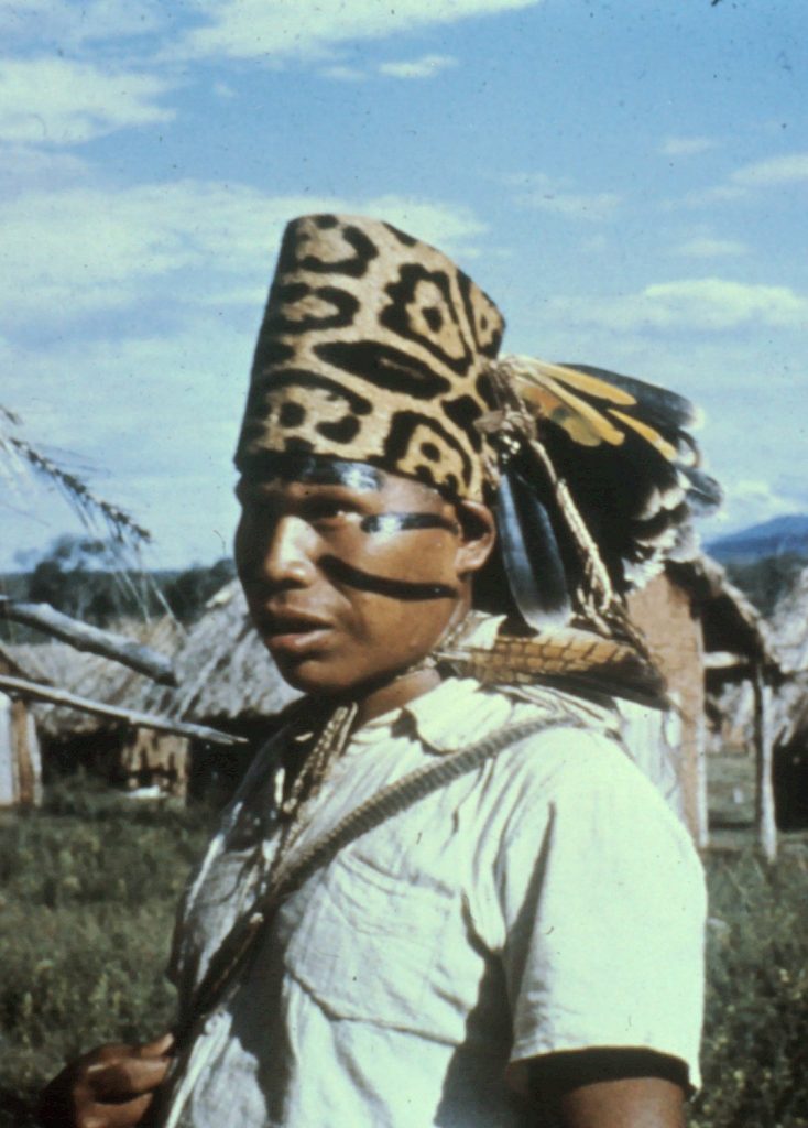 Ayoré asute (chief) in jaguar headdress with facial markings.