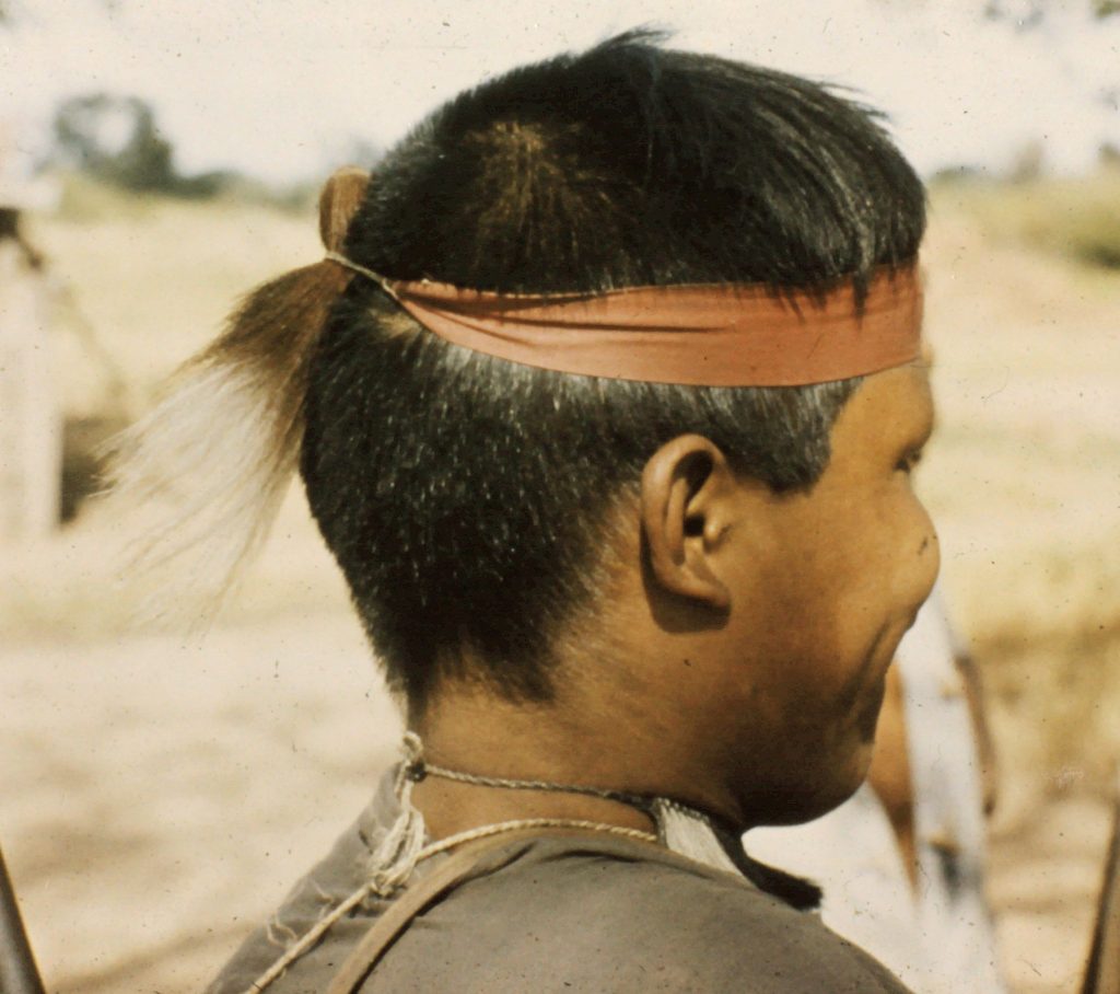 Ayoré man with hair necklace and headband.