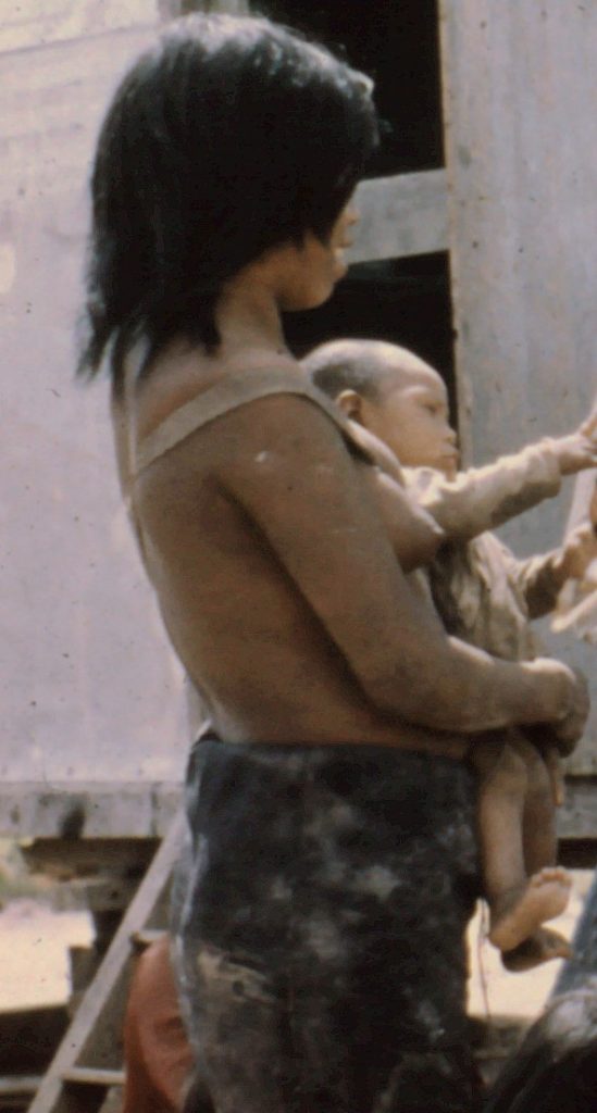Ayoré mother with baby in sling.